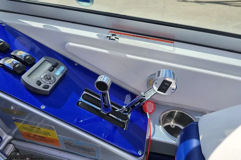 Slide: The Image of Control panel of a 2008 Formula 271 FASTech boat with throttle and switches. - 55