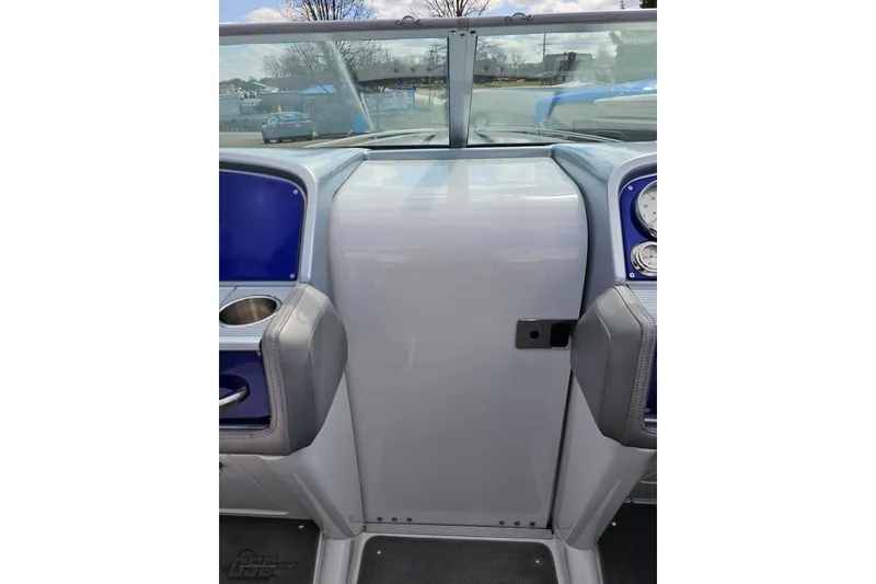 Slide: The Image of 2008 Formula 271 FASTech boat dashboard with blue accents and cup holders. - 56