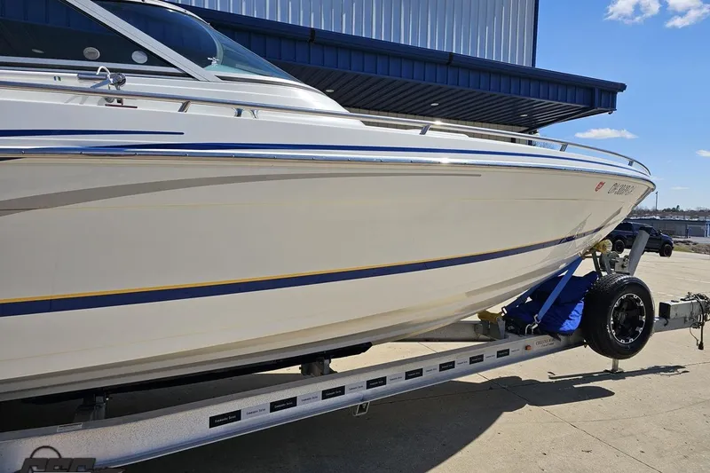 Slide: The Image of 2008 Formula 271 FASTech boat on trailer, side view, blue and yellow accents. - 6