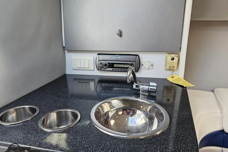 Slide: The Image of Interior of 2008 Formula 271 FASTech boat with sink and stereo system. - 67