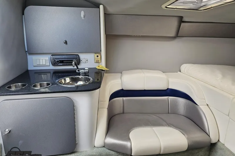 Slide: The Image of Interior of a 2008 Formula 271 FASTech boat with seating and kitchenette. - 68