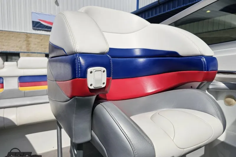Slide: The Image of 2008 Formula 271 FASTech boat seat with red, blue, and white upholstery in sunlight. - 75