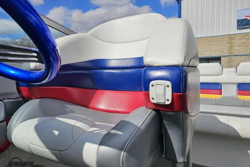 Slide: The Image of 2008 Formula 271 FASTech boat interior with colorful seating and steering wheel. - 76