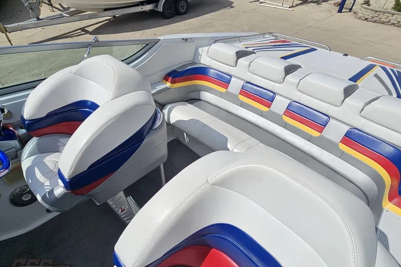 Slide: The Image of Interior of a 2008 Formula 271 FASTech boat with colorful, cushioned seating. - 78