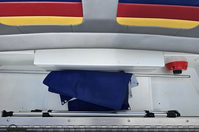 Slide: The Image of Storage compartment in a 2008 Formula 271 FASTech boat with colorful seating. - 81