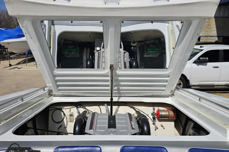 Slide: The Image of 2008 Formula 271 FASTech boat engine compartment with open hatch, showcasing dual engines. - 83