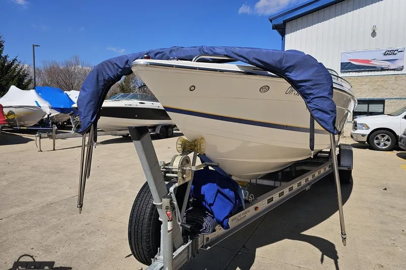 Slide: The Image of 2008 Formula 271 FASTech boat on trailer, covered and parked outdoors. - 89