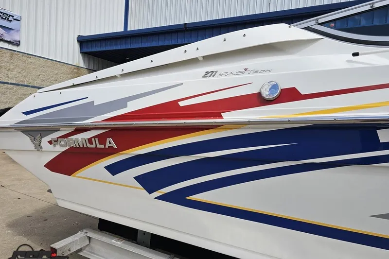 Slide: The Image of 2008 Formula 271 FASTech boat with vibrant red, blue, and yellow graphics. - 9