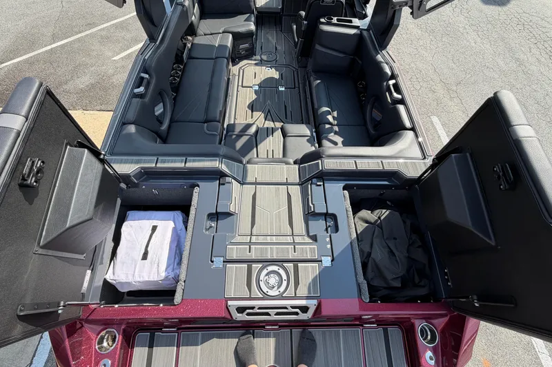 Slide: The Image of 2023 Supra SL 550 interior view with open storage compartments and seating arrangement. - 15