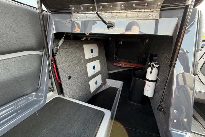 Slide: The Image of 2023 Supra SL 550 interior storage compartment with fire extinguisher and equipment. - 19