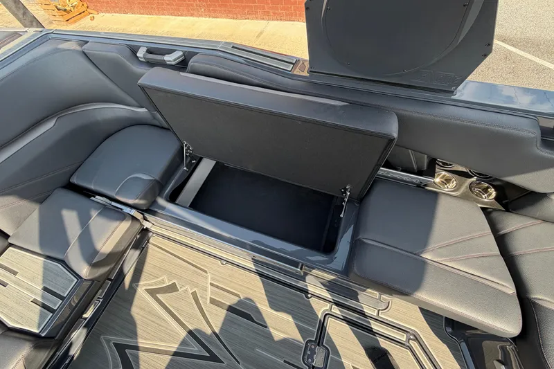 Slide: The Image of 2023 Supra SL 550 interior with open storage compartment and sleek seating design. - 21