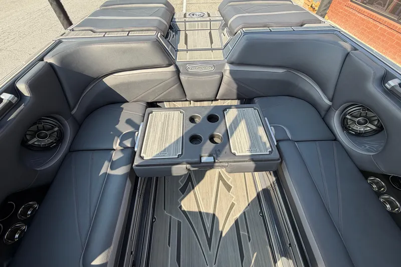 Slide: The Image of 2023 Supra SL 550 boat interior with luxurious seating and integrated speakers. - 22