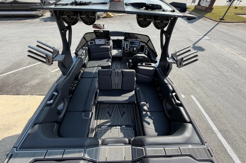Slide: The Image of Luxurious interior of 2023 Supra SL 550 boat with spacious seating and advanced audio system. - 24