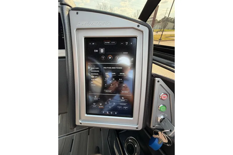 Slide: The Image of 2023 Supra SL 550 dashboard touchscreen displaying control settings and navigation options. - 27