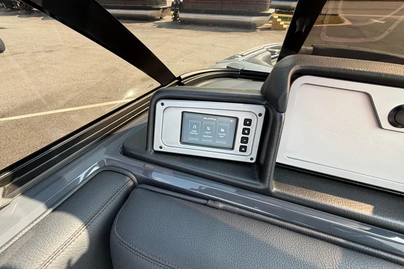 Slide: The Image of 2023 Supra SL 550 dashboard with touchscreen controls and sleek interior design. - 28