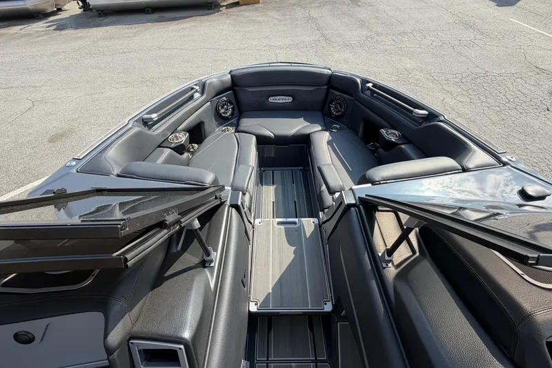 Slide: The Image of 2023 Supra SL 550 boat interior with sleek black seating and modern design. - 29