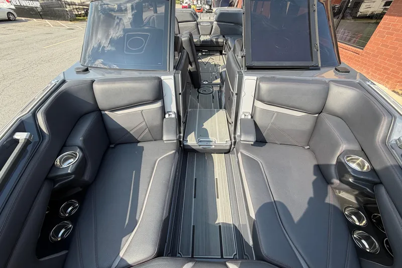Slide: The Image of 2023 Supra SL 550 boat interior with luxurious seating and cup holders. - 30