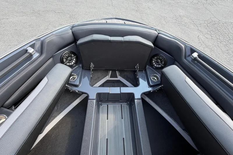Slide: The Image of 2023 Supra SL 550 boat interior with sleek seating and built-in speakers. - 32