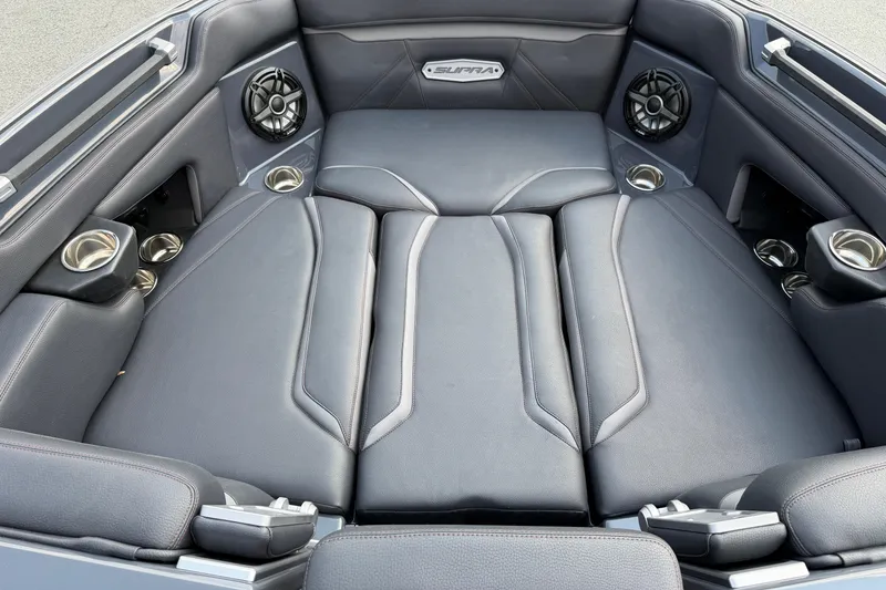 Slide: The Image of 2023 Supra SL 550 interior with luxurious seating and integrated speakers. - 33