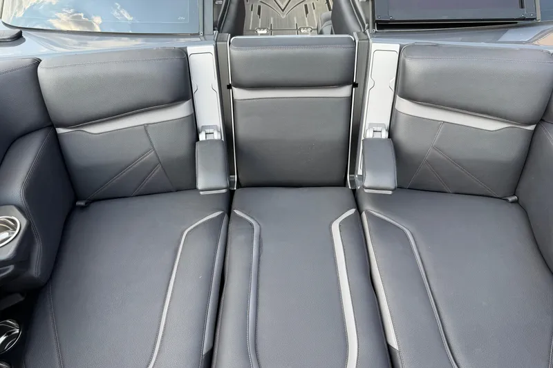 Slide: The Image of 2023 Supra SL 550 interior with sleek black leather seats and modern design. - 34