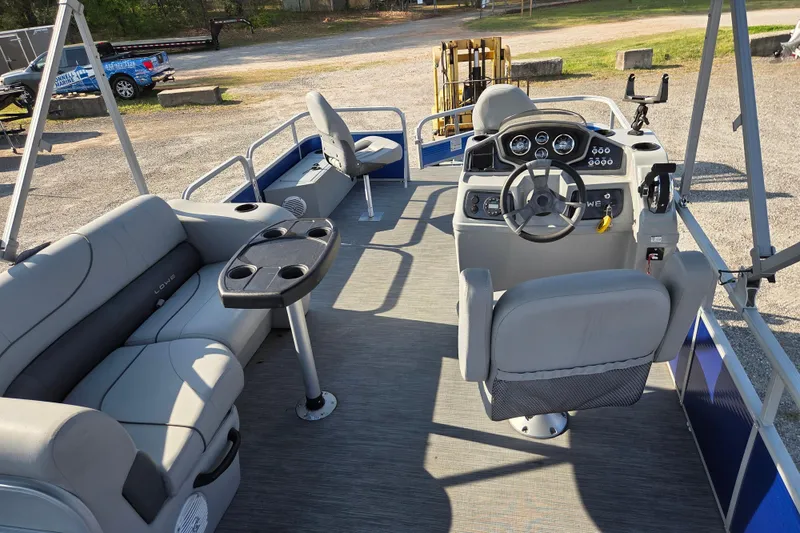 Slide: The Image of 2022 Lowe SF 194 Sport Fish boat interior with seating and steering console. - 10