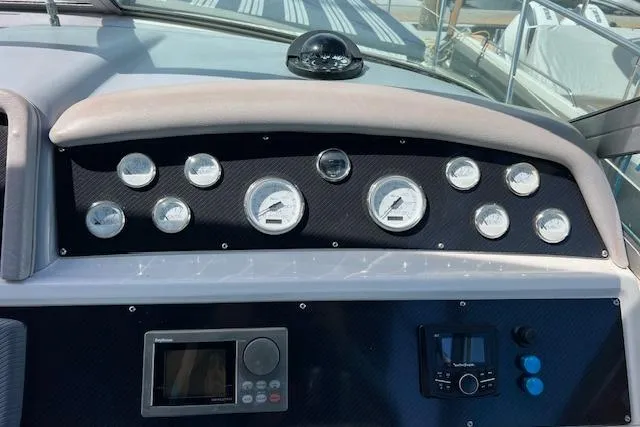 Slide: The Image of Electrical panel of a 1994 Sea Ray Sundancer 400 boat with red wiring and switches. - 20