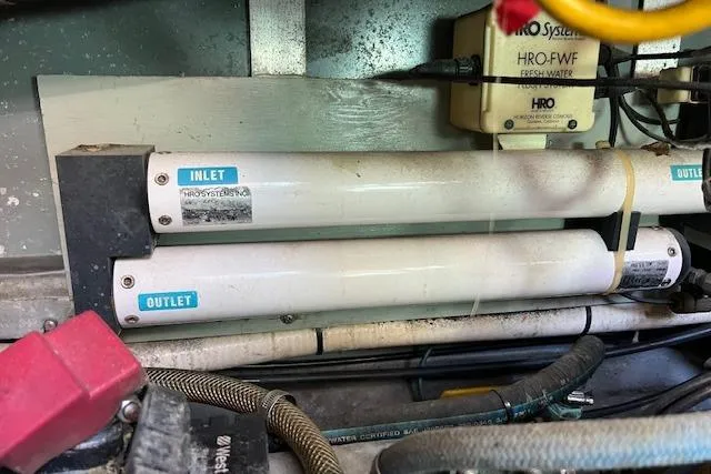 Slide: The Image of Interior of 1994 Sea Ray 400 Express Cruiser with modern seating and kitchen amenities. - 32