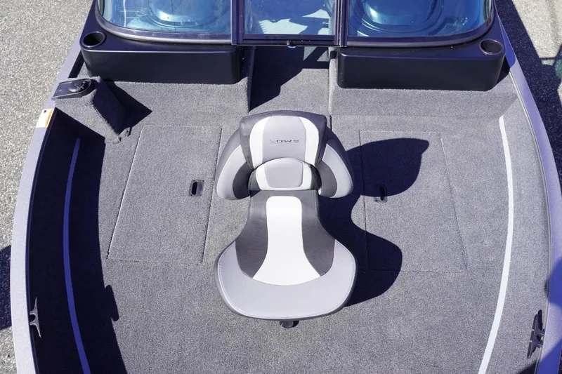 Slide: The Image of 2026 Lowe Fishing Machine 1775WT boat interior with cushioned seat and carpeted deck. - 12