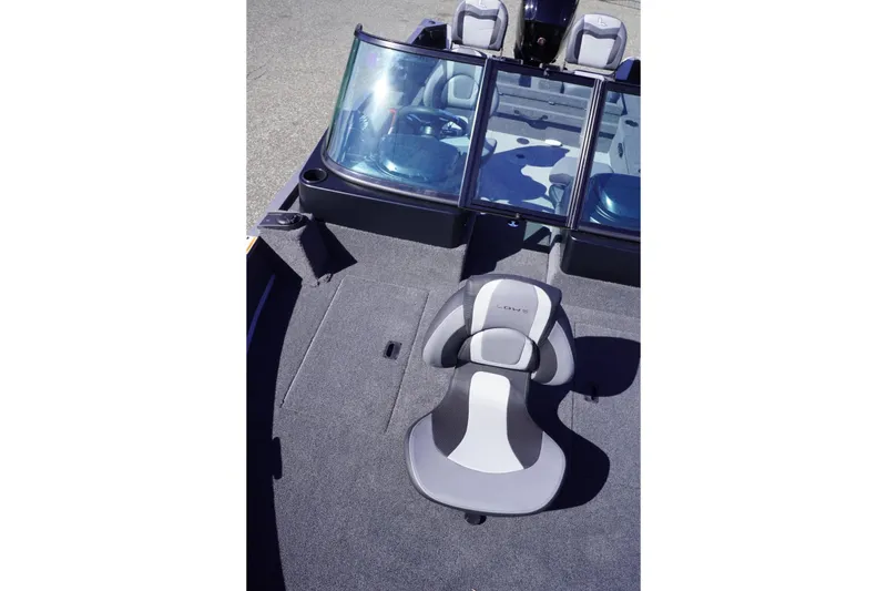 Slide: The Image of 2026 Lowe Fishing Machine 1775WT interior with seating and windshield, showcasing modern design. - 15