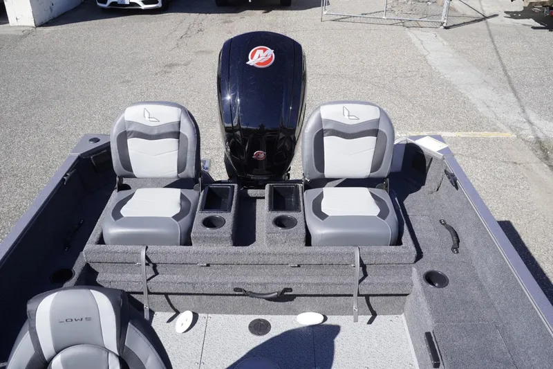 Slide: The Image of 2026 Lowe Fishing Machine 1775WT interior with seating and storage compartments. - 17