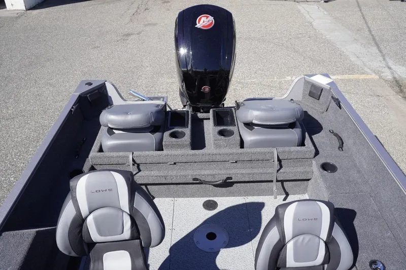 Slide: The Image of 2026 Lowe Fishing Machine 1775WT interior with seating and storage compartments. - 20