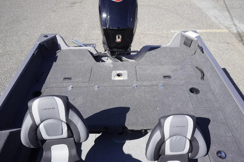 Slide: The Image of 2026 Lowe Fishing Machine 1775WT interior with two seats and motor, ideal for fishing. - 21