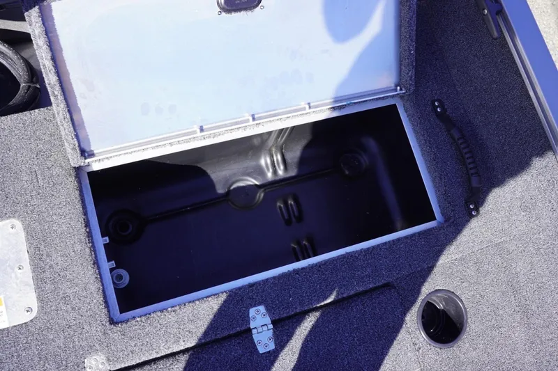 Slide: The Image of Open storage compartment on 2026 Lowe Fishing Machine 1775WT boat. - 30