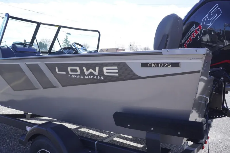 Slide: The Image of 2026 Lowe Fishing Machine 1775WT boat with Mercury Pro XS engine, side view. - 6