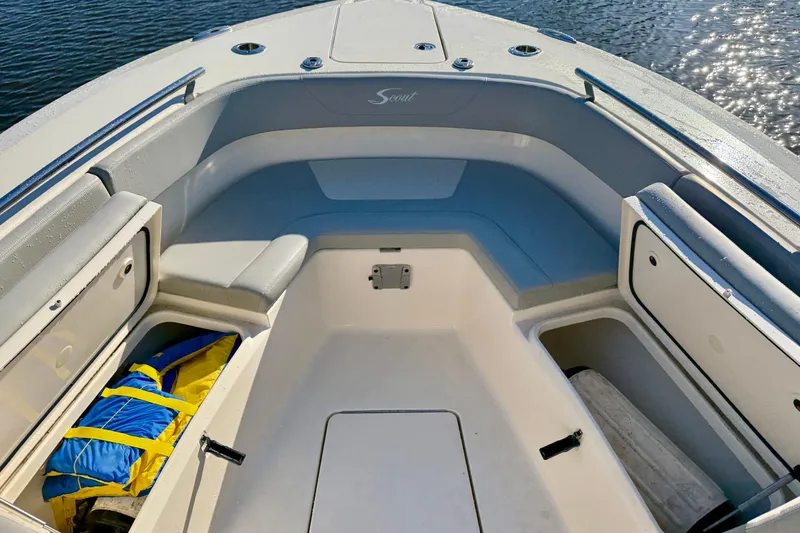Slide: The Image of 2022 Scout 277 LXF boat interior with seating and storage compartments. - 17