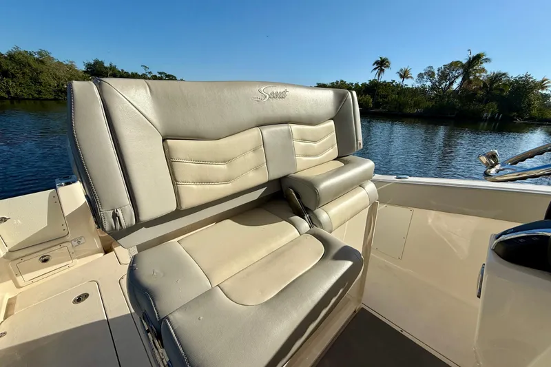 Slide: The Image of 2022 Scout 277 LXF boat seat with luxurious leather upholstery by the water. - 24