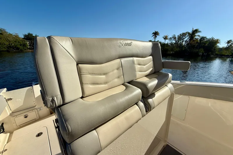Slide: The Image of 2022 Scout 277 LXF boat seat with luxurious leather upholstery by the water. - 25