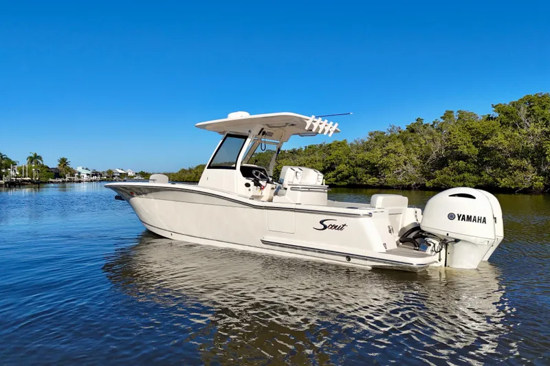 Slide: The Image of 2022 Scout 277 LXF boat with Yamaha engine on calm water. - 3