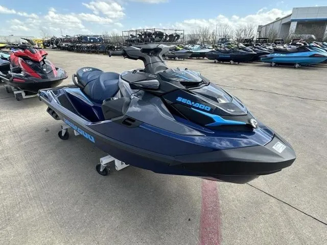Slide: The Image of 2026 Sea-Doo GTX jet ski parked outdoors on a sunny day. - 12