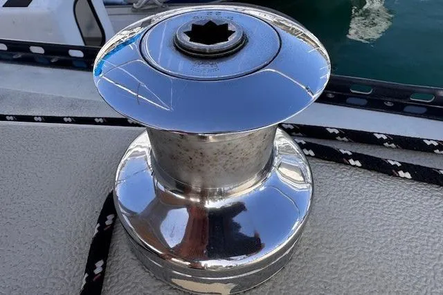 Slide: The Image of Shiny winch on 1977 Islander 32 sailboat deck with rope. - 12