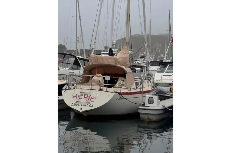 Slide: The Image of 1977 Islander 32 sailboat docked at Dana Point marina. - 3