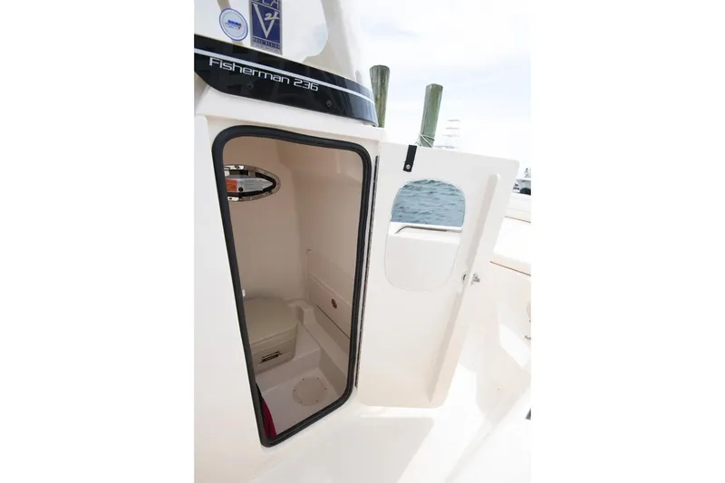 Slide: The Image of Manufacturer Provided Image: 2024 Grady-White Fisherman 236 boat interior cabin with open door. - 12