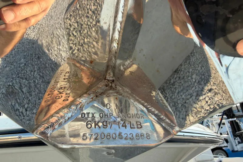 Slide: The Image of Close-up of a shiny anchor on a 2024 Grady-White Fisherman 236 boat. - 14