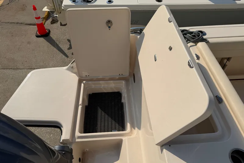 Slide: The Image of 2024 Grady-White Fisherman 236 boat storage compartment open on deck. - 17