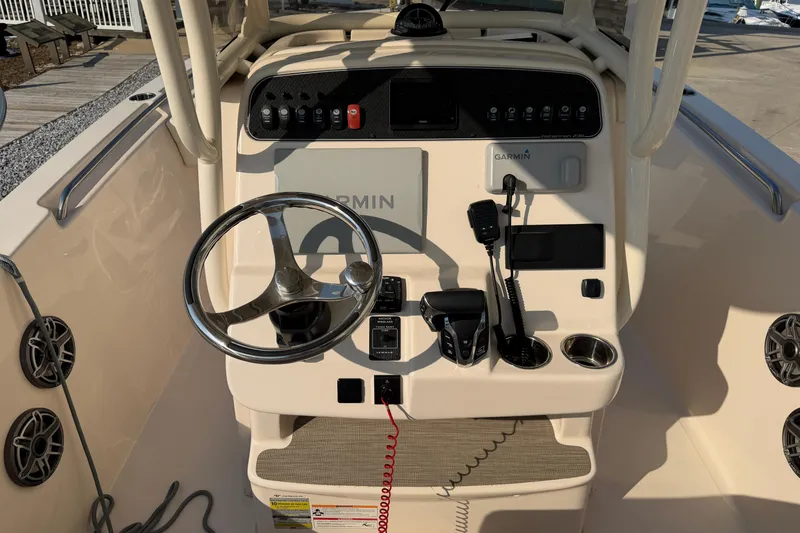 Slide: The Image of 2024 Grady-White Fisherman 236 boat console with Garmin electronics and steering wheel. - 18