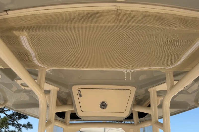 Slide: The Image of 2024 Grady-White Fisherman 236 boat interior ceiling with storage compartment. - 19