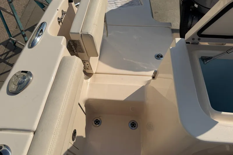 Slide: The Image of 2024 Grady-White Fisherman 236 boat interior, featuring seating and storage compartments. - 20