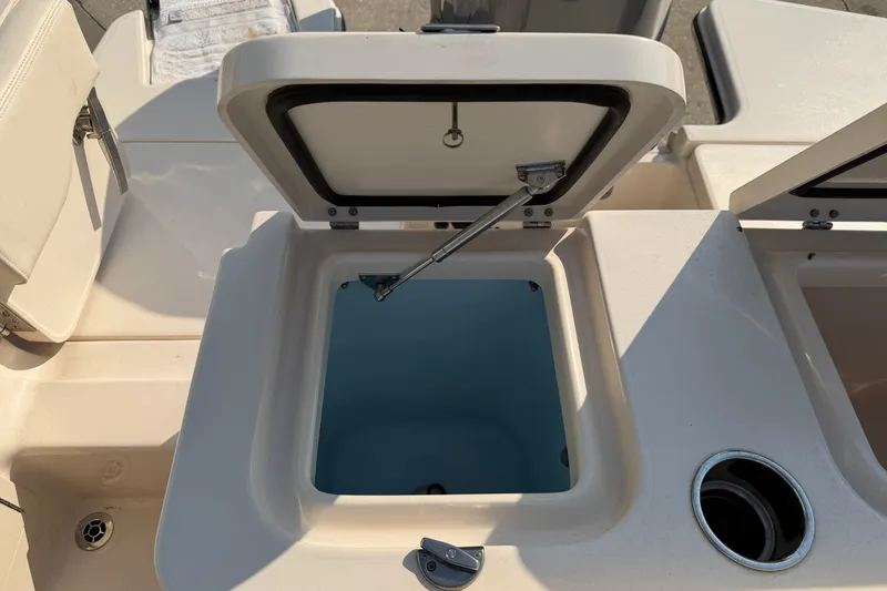 Slide: The Image of Open storage compartment on 2024 Grady-White Fisherman 236 boat deck. - 21