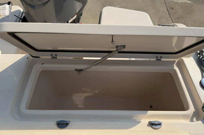 Slide: The Image of Open storage compartment on 2024 Grady-White Fisherman 236 boat, showcasing interior space. - 22