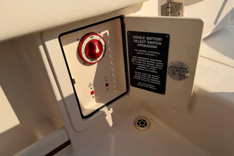 Slide: The Image of 2024 Grady-White Fisherman 236 battery switch panel with operation instructions. - 23